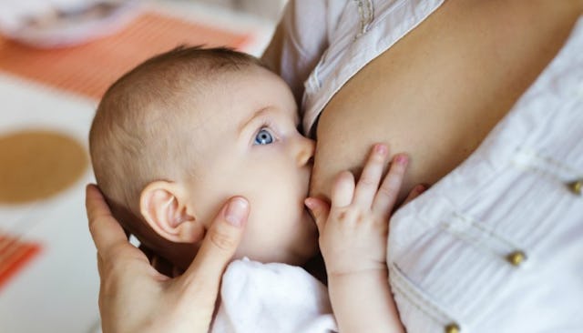 A mother breastfeeding her baby