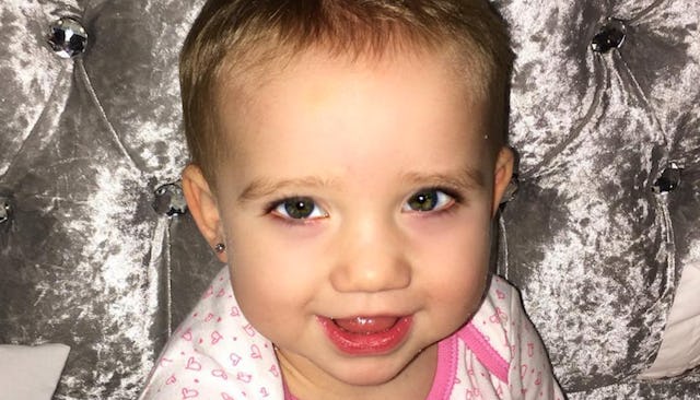 Little baby with pierced ears