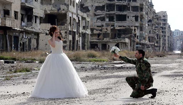 A young couple in Homs, Syria, used the war-ravaged city as the backdrop for their wedding photos.