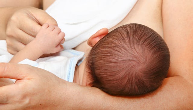 A mother breastfeeding her baby.