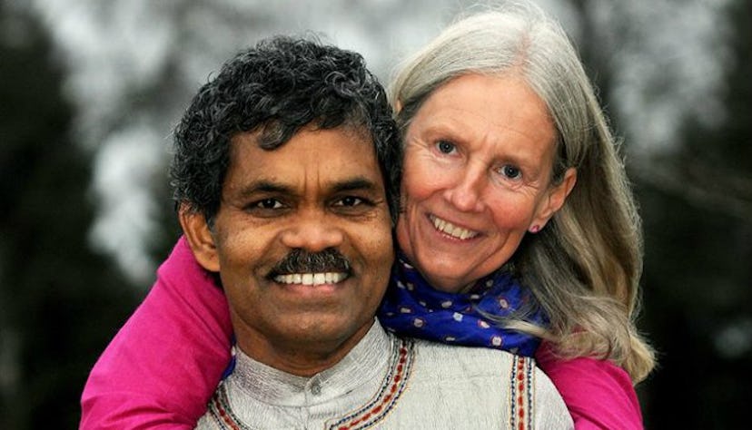 PK Mahanandia and his wife Charlotte Von Schedvin hugging and smiling