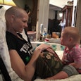Joey feek sitting in a hospital bed with her baby sitting opposite her, both smiling at each other