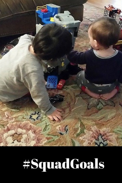 Two kids playing floor