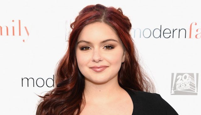 Ariel Winter in a black dress posing at a red carpet event