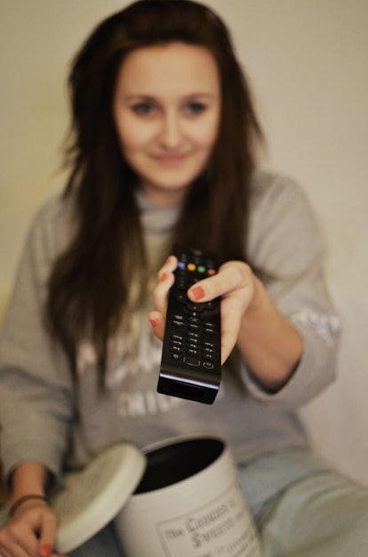 woman-girl-remote-watching
