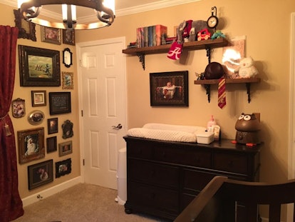 The inside of a 'Harry Potter' inspired nursery with a wall decorated with pictures
