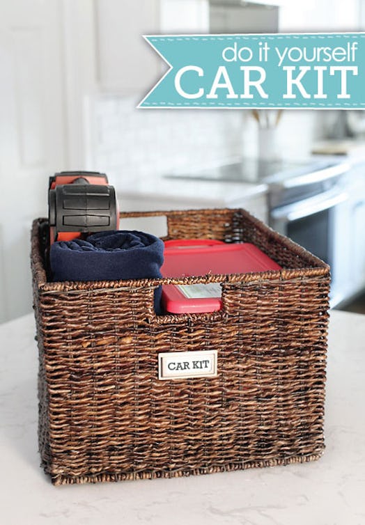 A decorative basket for a car containing emergency supplies and tools