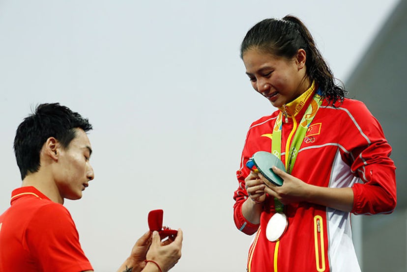 He Zi getting the surprise of a lifetime from boyfriend Qin Kai. Image via Clive Rose/Getty Images.