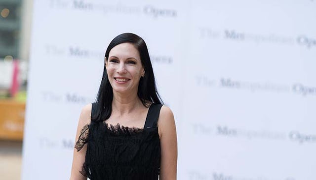 Jill Kargman wearing a black dress at a red carpet event