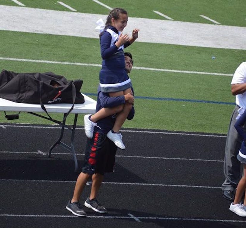 student rescues cheerleader