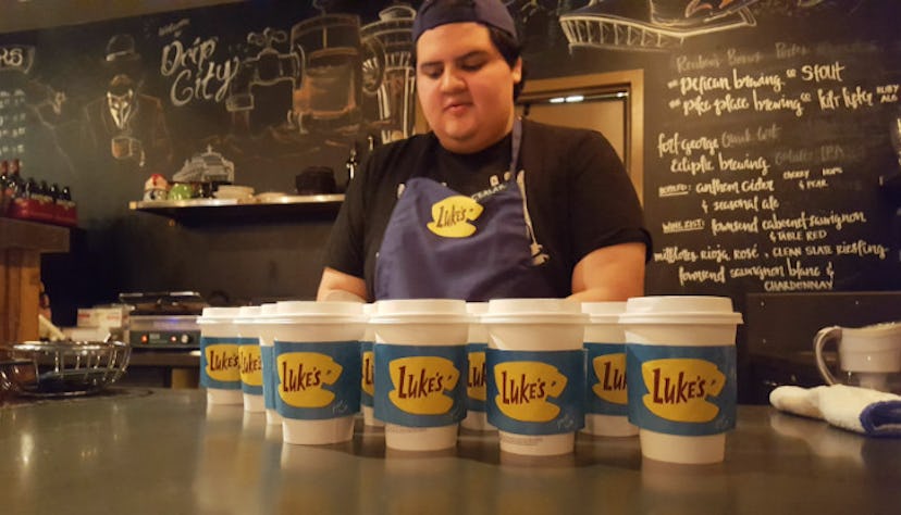Barista and Gilmore Girls fan Ceaser Villa preps the free coffee for fans. 