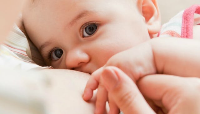 Granddaughter holding her grandma's finger