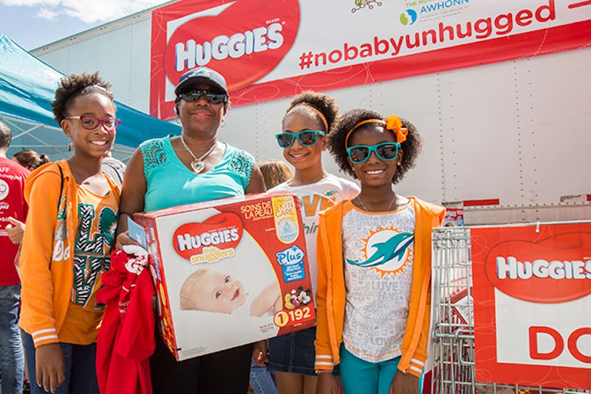 Miami Dolphins fans brought donations to a diaper drive hosted by Huggies. Image via Huggies. 