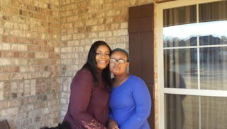 Keli Goochs standing with her daughter, who has down syndrome, and has found peace after the life-ch...