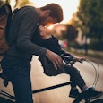 Dad kissing his son on the bicycle