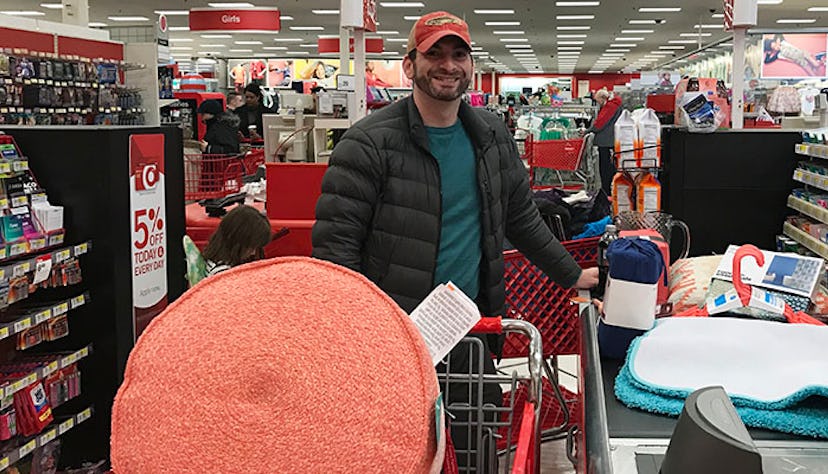 A man shopping at Target with a big smile on his face