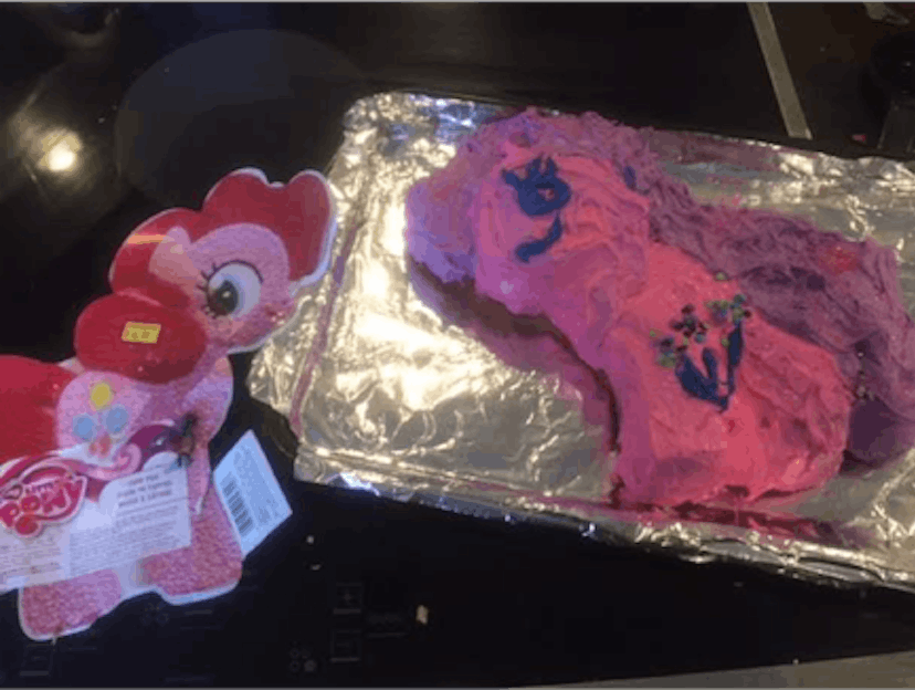 A pink birthday cake shaped like a My Little Pony character