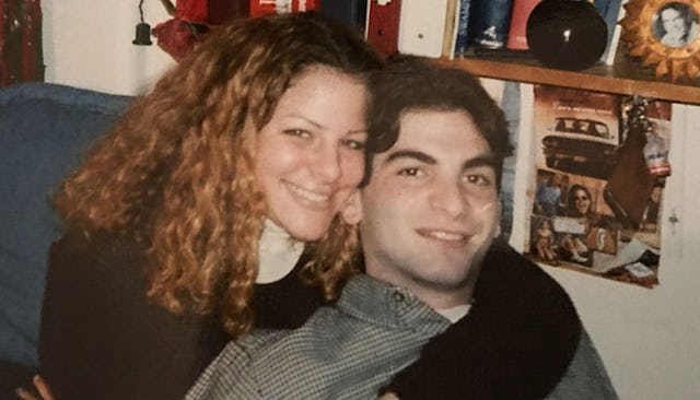 A young couple smiling while being in a hug