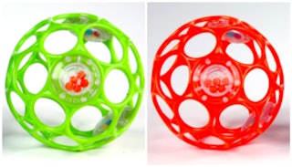 Two Oball rattles in green and red that have been recalled due to choking risk