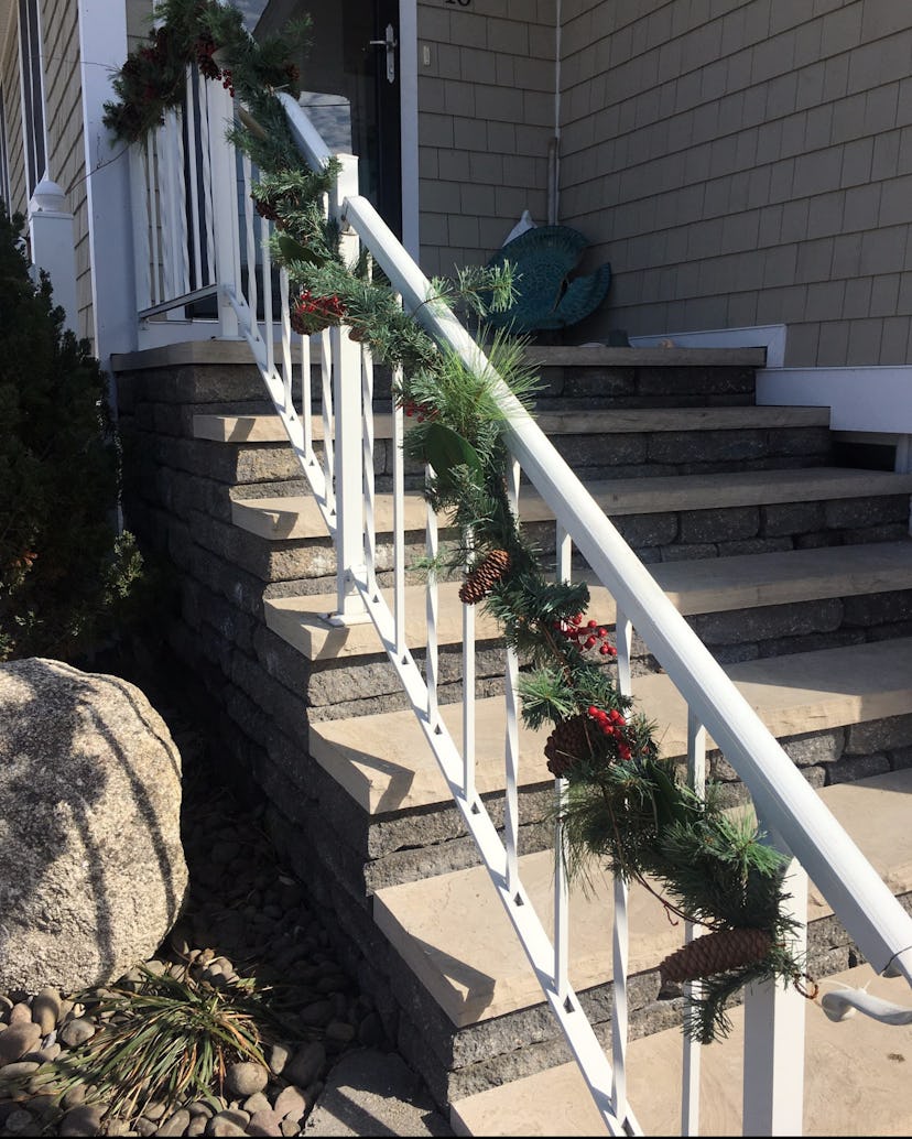 House stairs with Christmas decorated fence 