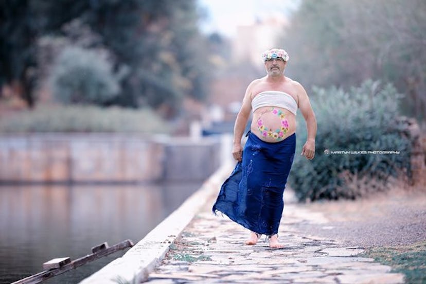 Dad's maternity photo of him walking next to a river