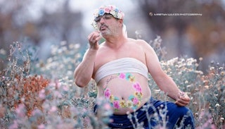 Dad's maternity photo where he is frollicking in a field of flowers