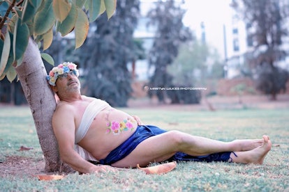 Dad's maternity photo where he is blissfully lying under a palm tree