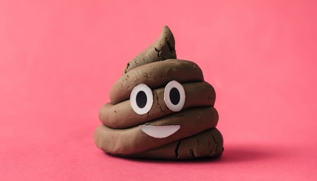 Poop-shaped play-doh with eyes and mouth taped onto it.