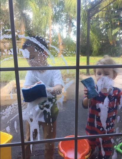 Two boys cleaning windows