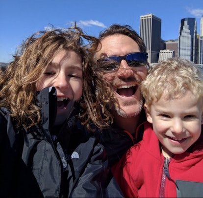Dad and two kids in the city having fun while mom is on a girls' trip