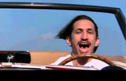 Richard Edson driving a car in Ferris Buellers day off