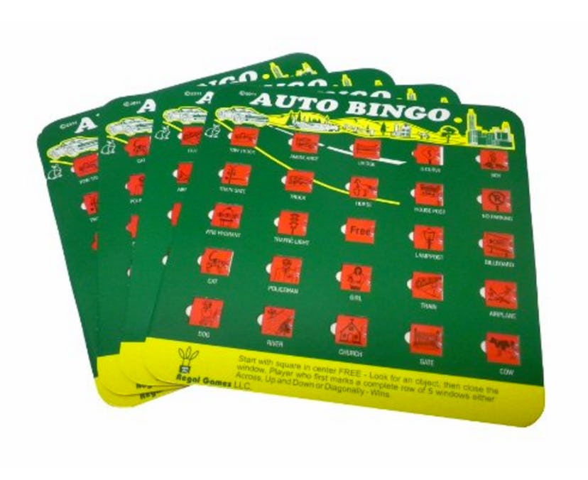 4 green cards for travel bingo with red number marks and a yellow stripe