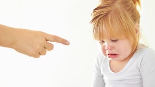 A little girl being mocked because of her crying