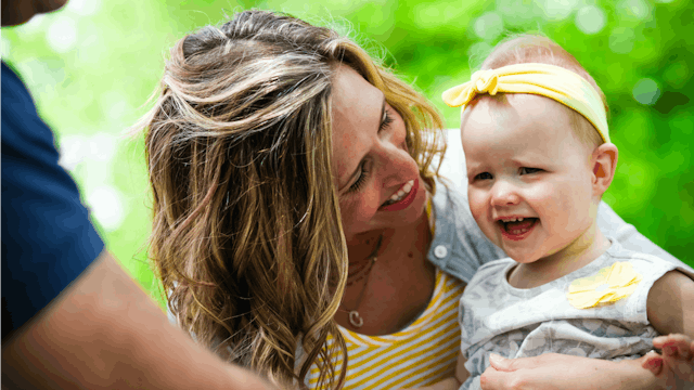 Mother smiling at her kid with special needs