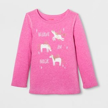 A pink shirt with unicorns 