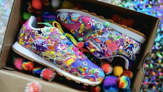 Pair of really colorful Lisa Frank Reebok Sneakers in a shoe box filled with colorful little balls.