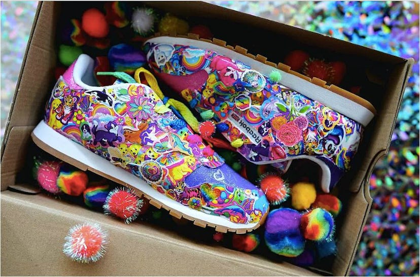 Pair of really colorful Lisa Frank Reebok Sneakers in a shoe box filled with colorful little balls.
