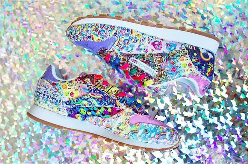 Pair of really colorful Lisa Frank Reebok Sneakers placed on a sparkly background.