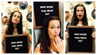 Tara Wood holding a "What would Tara Wood do?" sign