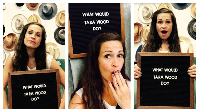 Tara Wood holding a "What would Tara Wood do?" sign
