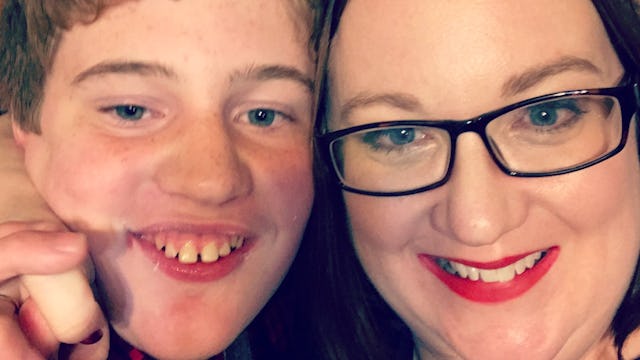 Teenage son with special needs and the mother he follows in women's restrooms
