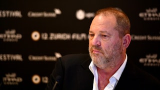 Harvey Weinstein in a white shirt and black blazer at a red carpet event