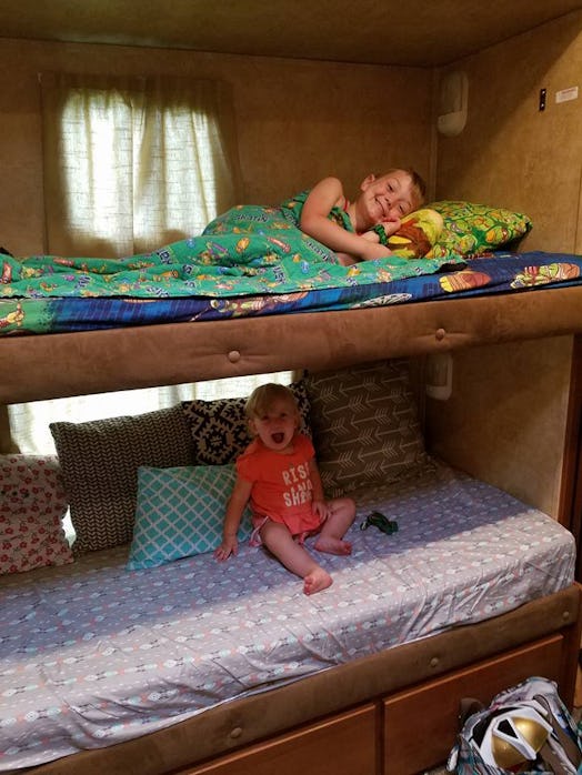 Brynn Burger's children preparing for bedtime on their double-deck bed and smiling