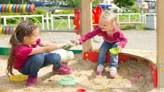 A brunette girl and a blonde girl being a jerk, both wearing burgundy shirts and blue denim jeans in...