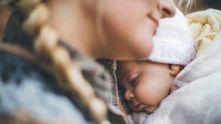 A mother hugging her baby