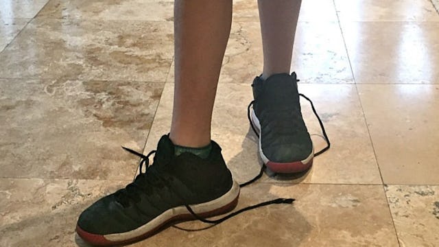 Kid refusing to tie his shoes