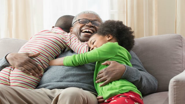 Grandpa hugging his grandchildren