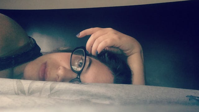 Danielle Hark laying on a bed and thinking about her depression relapse and surviving it