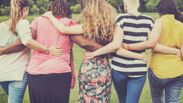 Five friends of parents of kids with special needs hugging each other outside