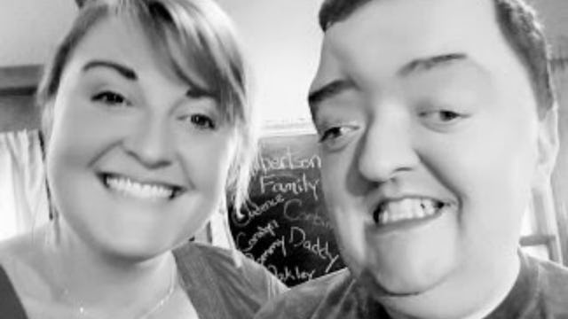 Kira Gilbertson and her brother with a developmental disability smiling in a black and white selfie
